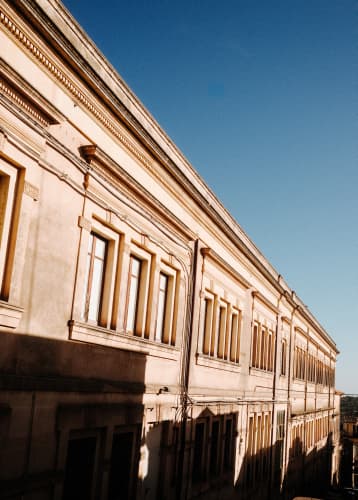 The Greece 2026 trip cover, a sunlit street in Greece